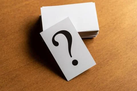 Question mark heap on table concept for confusion, question or solution Stock Photos