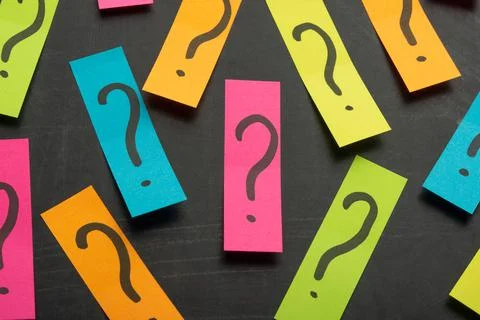 Question mark heap on table concept for confusion, question or solution Stock Photos