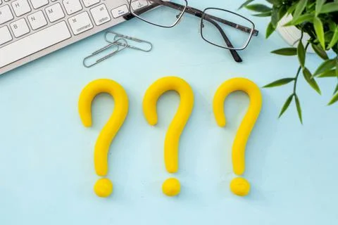 Question mark icon on office or students desk. Solving problem concept Stock Photos