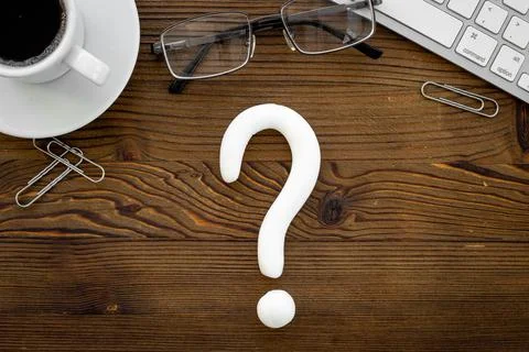 Question mark icon on office or students desk. Solving problem concept Fotos de archivo