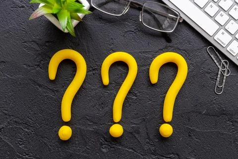 Question mark icon on office or students desk. Solving problem concept Stock Photos