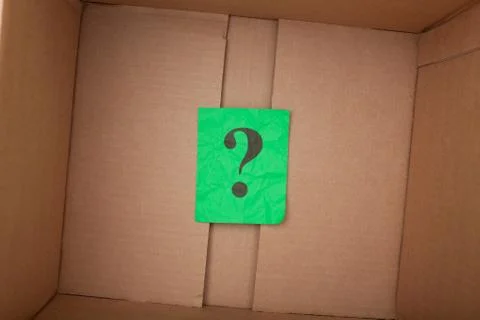 Question mark inside of a cardboard box Stock Photos