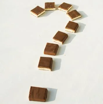 Question mark. made of chocolate bar on a white background Stock Photos