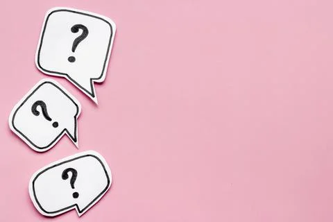Question mark on paper bubbles, top view. Question concept Stock Photos