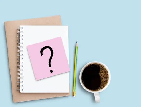 Question mark on pink sticky note with pencil and coffee on blue table back.. Stock Photos