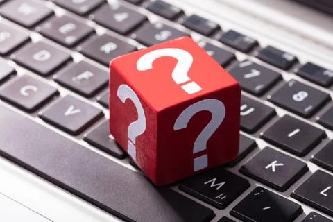 Question Mark Red Block Over The Laptop Keypad Foto stock