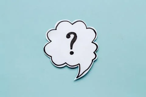 Question mark symbol on speech bubble, top view Stock Photos