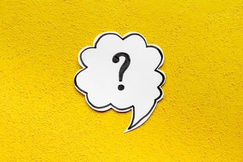 Question mark symbol on speech bubble, top view Stock Photos