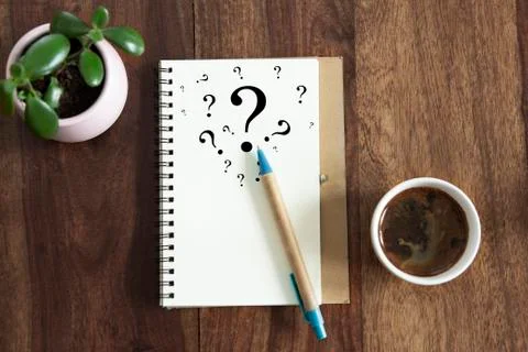 Question mark symbols in notebook Stock Photos