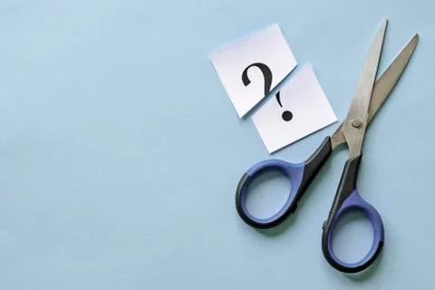 Question mark on a white card cut through Foto stock