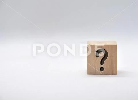 Question mark on wooden cube on white background. Stock Photo #255300240