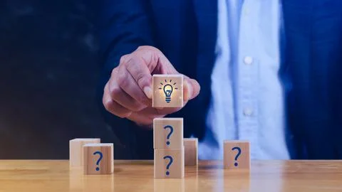 Question marks and light bulb symbolizing idea or solution, Problem solving.. Stock Photos