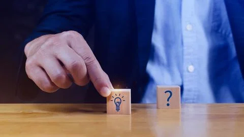 Question marks and light bulb symbolizing idea or solution, Problem solving.. Stock Photos