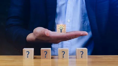 Question marks and light bulb symbolizing idea or solution, Problem solving.. Stock Photos