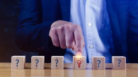 Question marks and light bulb symbolizing idea or solution, Problem solving.. Stock Photos