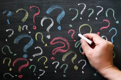 Question marks on chalkboard. decision, confusion, faq or other concept. hand Stock-Fotos