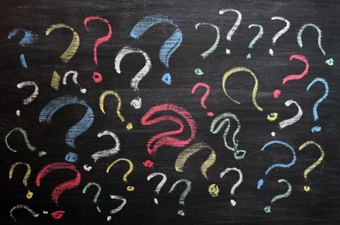 Question marks on chalkboard. decision, confusion, faq or other concept. hand Foto stock