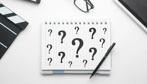 Question marks on notepad. Business concept Stock Photos