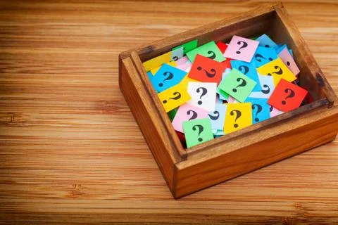 Question marks in a wooden box Stock Photos