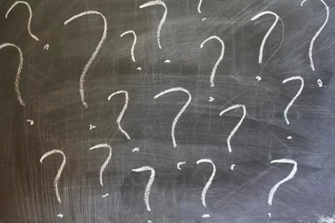 Question marks written on blackboard Stock Photos
