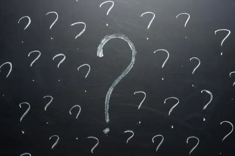 Question marks written on blackboard. Problems to solve concept. Stock Photos