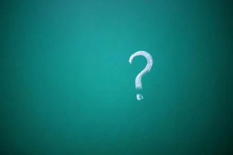 Question marks written on the chalkboard. Problems to solve concept. Stock Photos