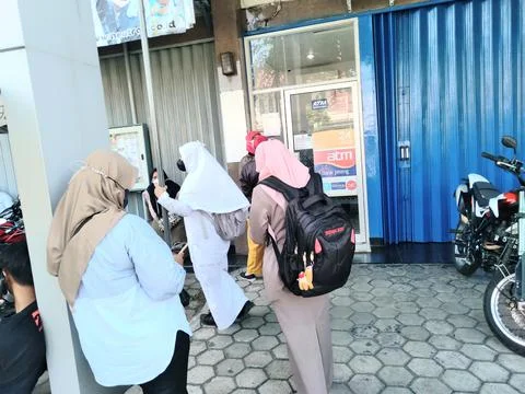 Queue at automatic teller machine Stock Photos