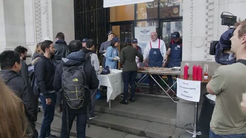A queue at the democracy sausage stall outside Australia House Video stock 345298952