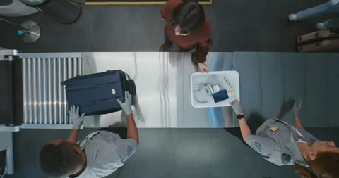 Queue of Diverse People, Passengers Putting Personal Items in Plastic Trays for Stock Footage 306784465