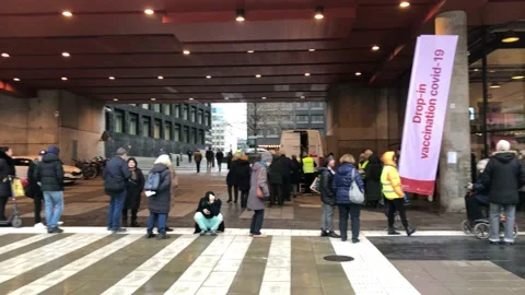 Queue for drop-in COVID-19 vaccine in Stockholm Stock Footage 165447790