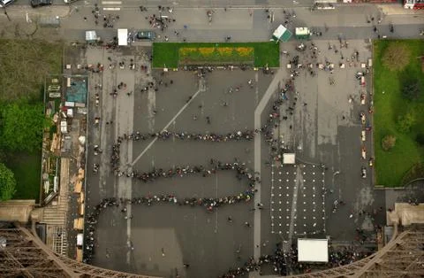 Queue eiffel tower paris line people tourists. View from top Stock Photos