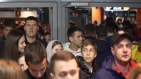 Queue of fans waiting for start of match in stadium hall Stock Footage 259562513