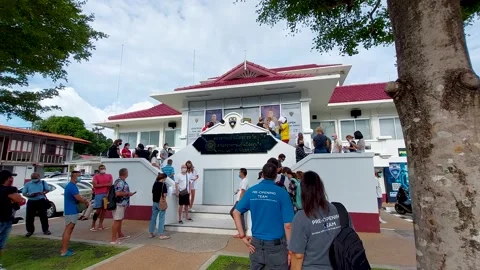 A queue of foreigners at the Immigration Center to resolve visa issues Video stock 171774354