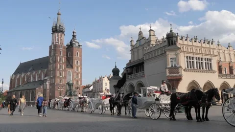 Queue of Horse Carriages on Market Square with Cloth Hall,Krakow,Poland Stock Footage 208897740