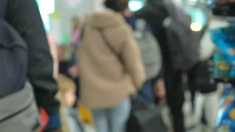 A queue inside the airport. Passengers stand in line for checking passports. 4K Video stock 262412564