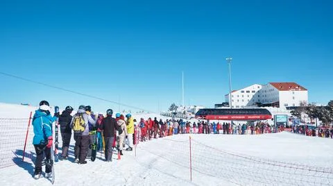 Queue line to cableway at ski resort Stock Photos