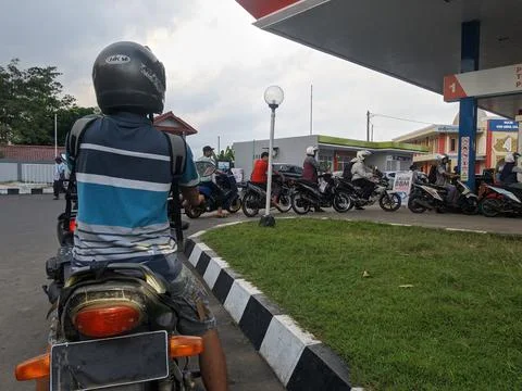 Queue of motorcycles at gas stations 스톡 사진