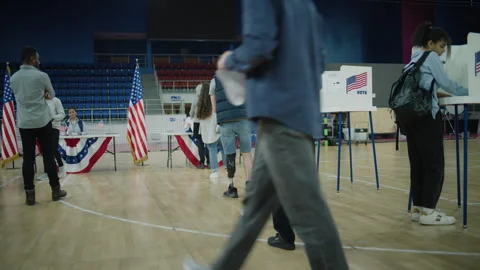 Queue of multicultural American citizens come to vote Stock Footage 273865323