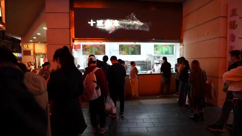 Queue at Nanjing Road bakery for qing tuan. Shanghai, China Stock Footage 319517476