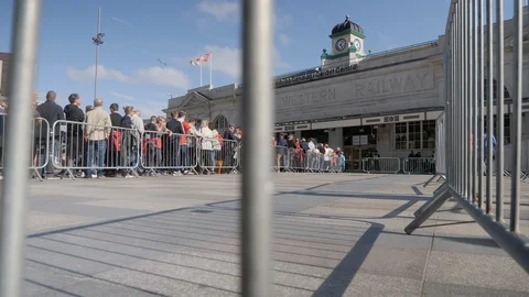 Queue outside central station cardiff through barrier Stock Footage 114412309