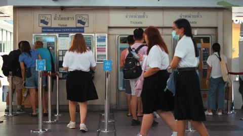 Queue of passengers buying tickets at the ticket office at BTS station, high Video stock 248352588