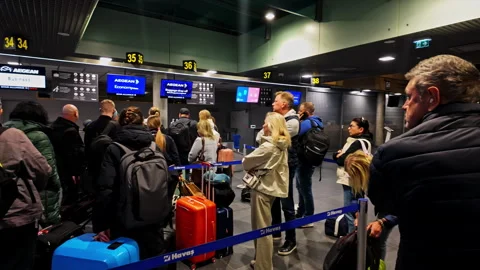 Queue Of Passengers At The Check-in Counters At Riga Airport In Latvia. - POV Stock Footage 298184800