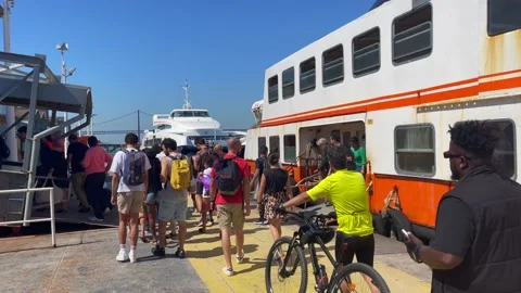 Queue of people disembarking a ferryboat at Cacilhas in Lisbon Stock Footage 220150941