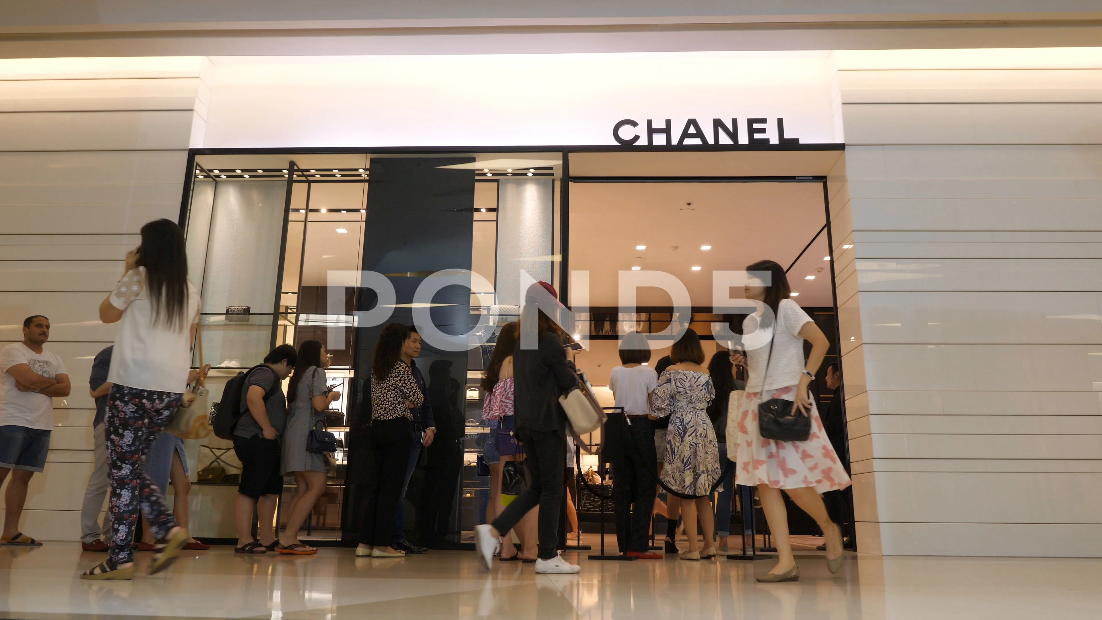Queue People in front of Chanel Clothing... | Stock Video | Pond5