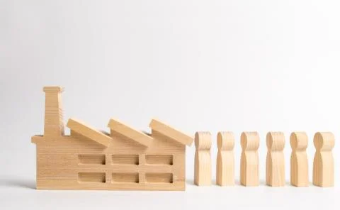 A queue of people line up at the factory. Workers go to work. Hiring. Develop Stock Photos
