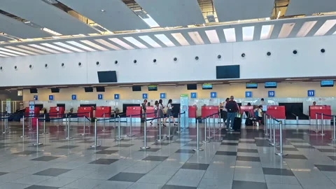 Queue of people waiting at boarding gate at airport Stock Footage 138600923