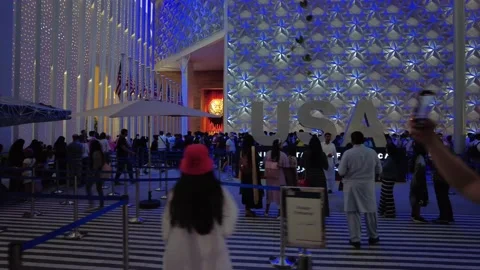 Queue of people waiting in line to get in the USA pavilion at Expo2020 in Dubai Stock Footage 179374444