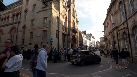 A queue of people waiting outside the Corn Exchange venue in Cambridge 스톡 동영상 275082832