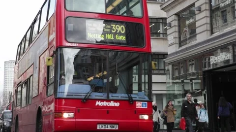 A queue of red buses and taxis on Oxford Street Stock Footage 57336584