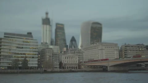 Queue of red buses on London bridge in late evening Stock Footage 146454944